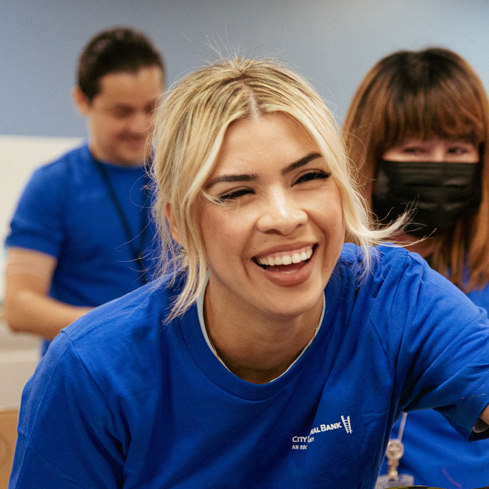 three colleagues laughing