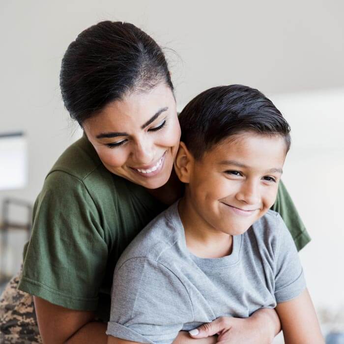 military-mom-hugging-son