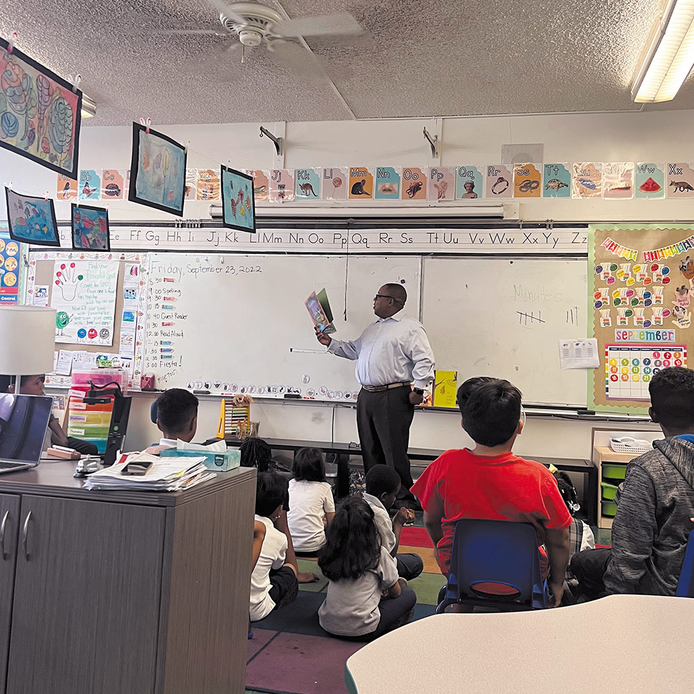 Teacher reads to students in classroom