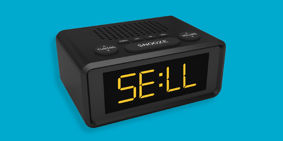 Digital alarm clock that reads "SELL" on its screen.