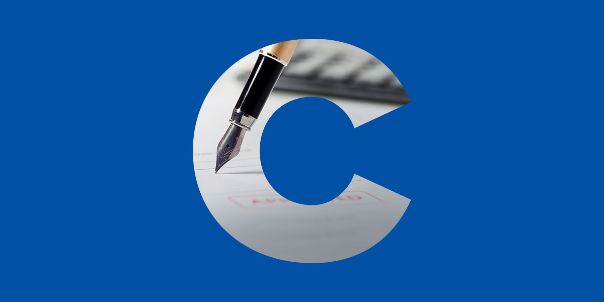 Letter "C" cutout with fountain pen on paper