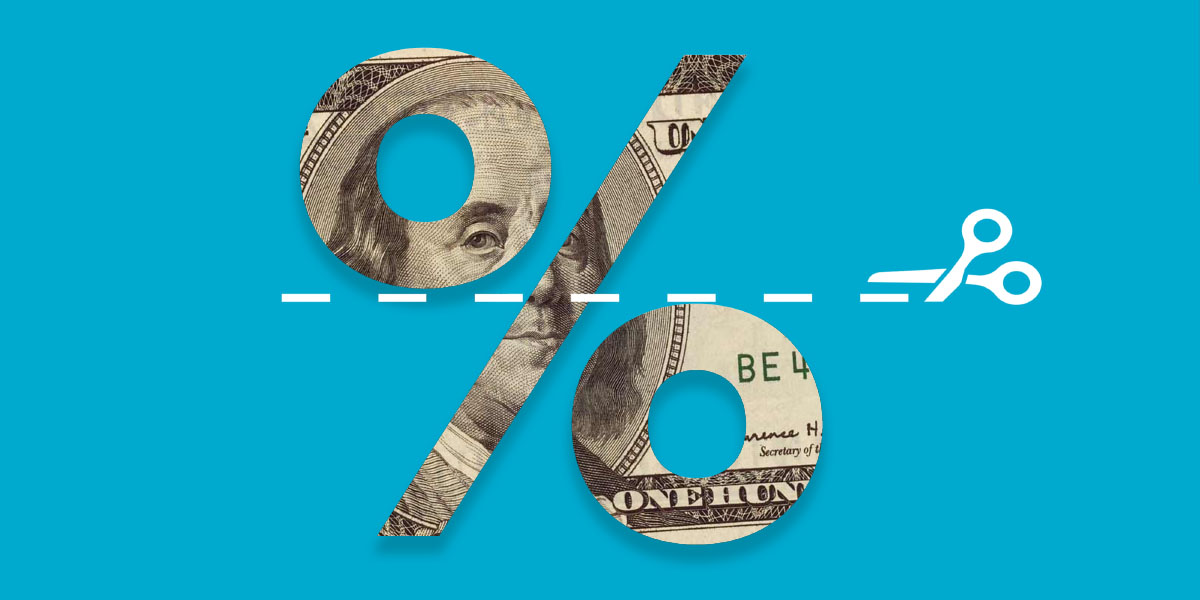 Percentage symbol cutout from $100 with scissors cutting through