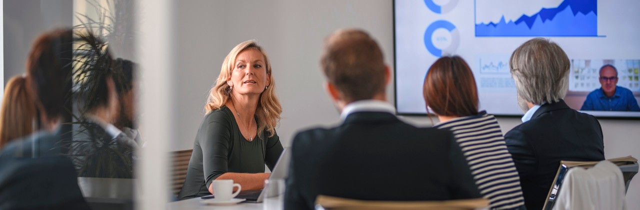People meeting at table in office
