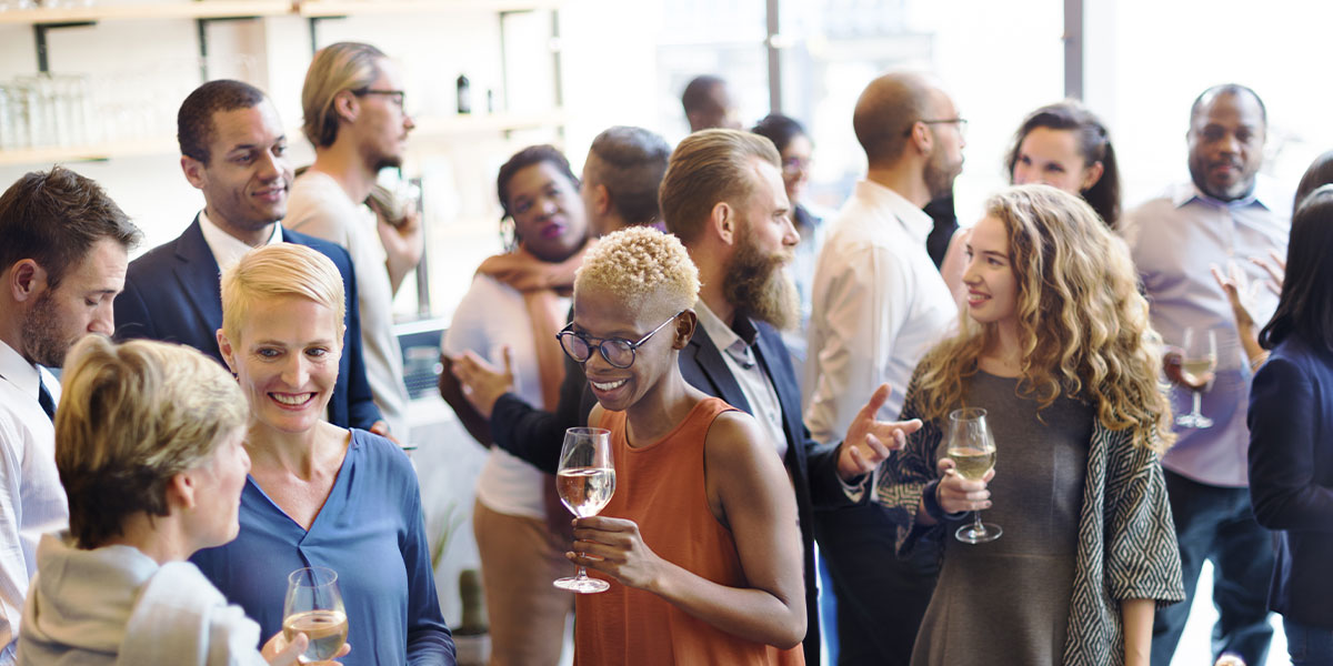 Group of employees enjoying a company networking event.