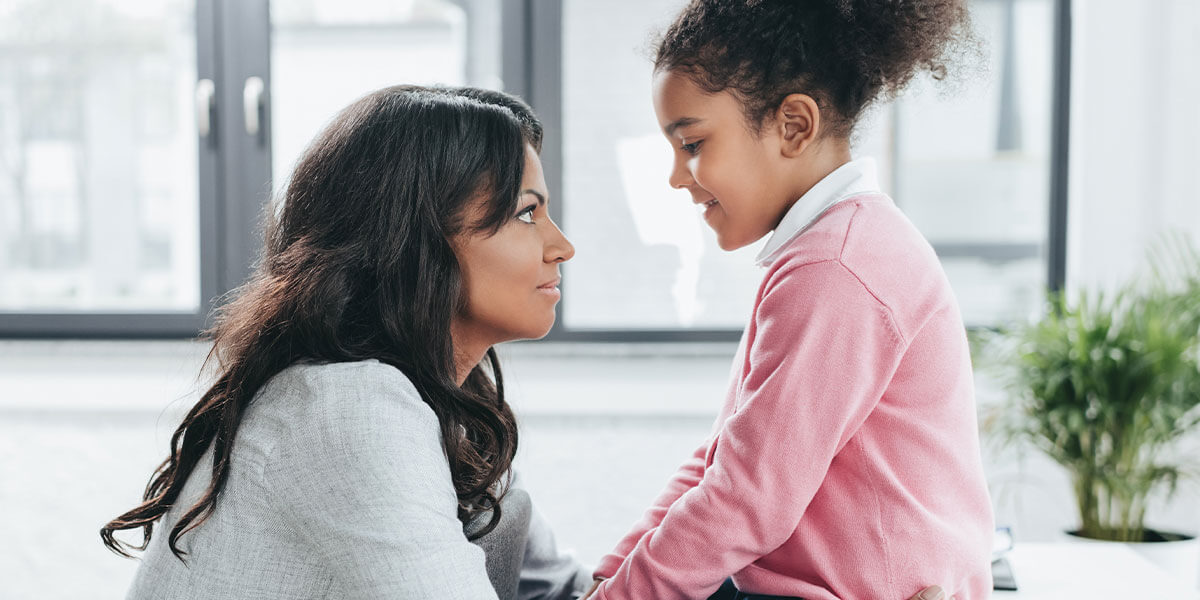 Mother bonds with her daughter at a acting and modeling audition for kids. 