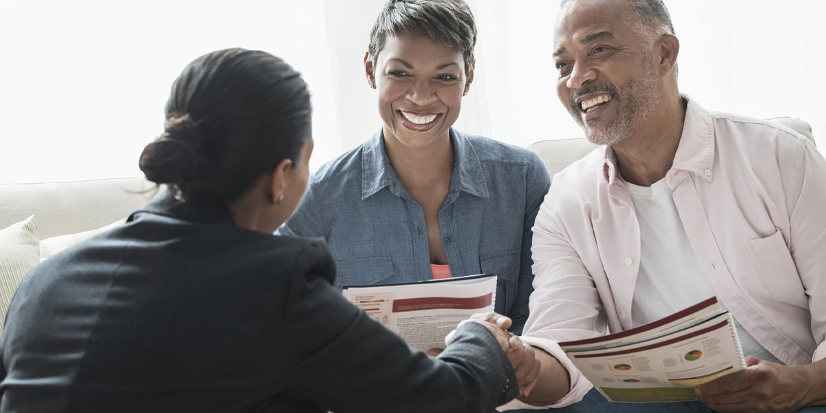 Couple meets with their professional trustee and estate executor to discuss details about their plan.