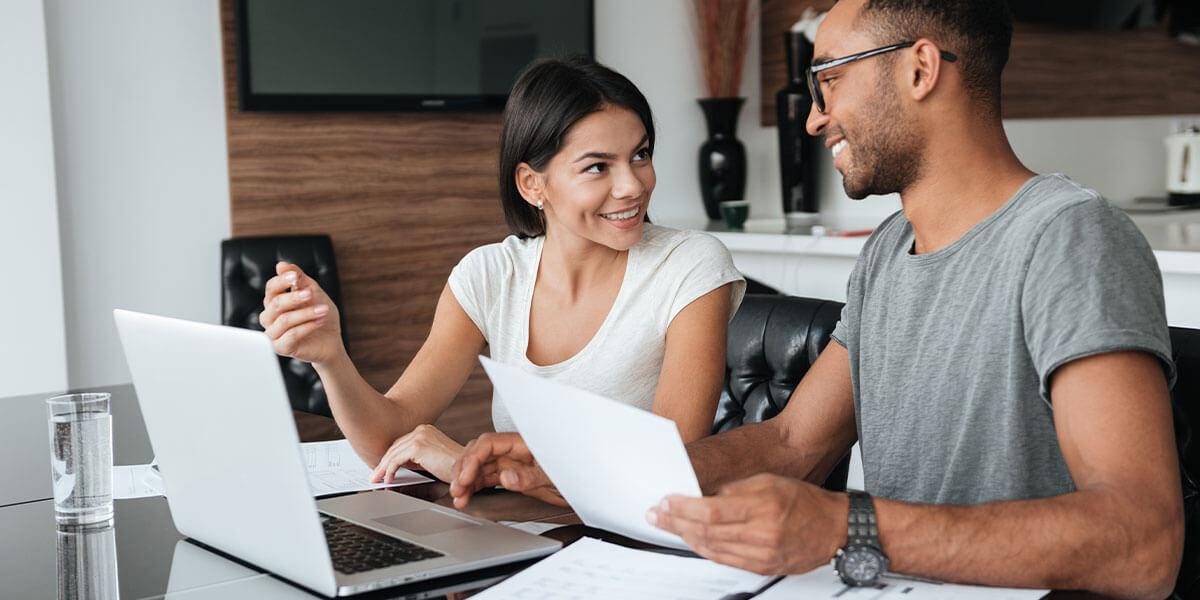 Couple reviewing their savings and checking accounts. 