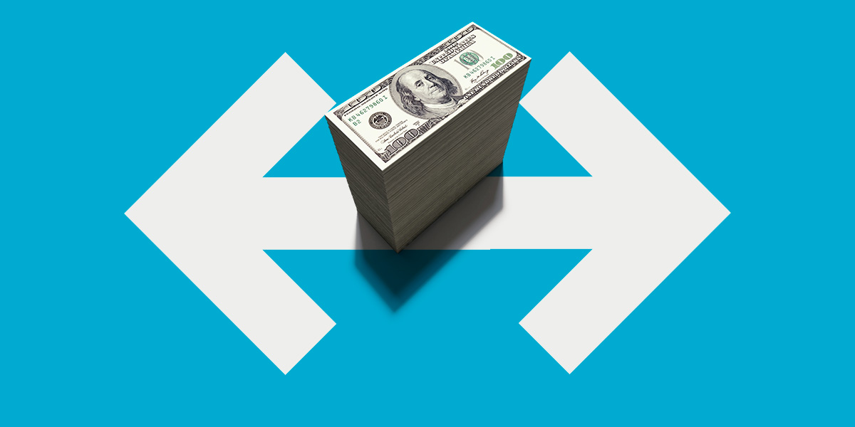Stack of money atop arrows pointing in opposite directions