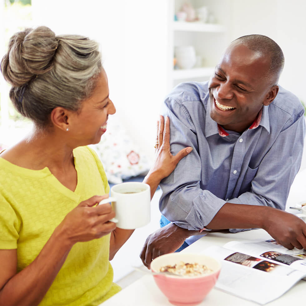 Senior couple discussing City National Bank's CDs for future savings