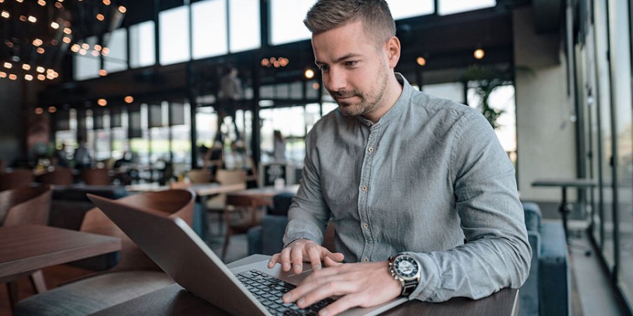 Person using laptop computer for Online Banking